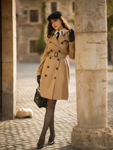 A lady wears a worsted wool trench coat